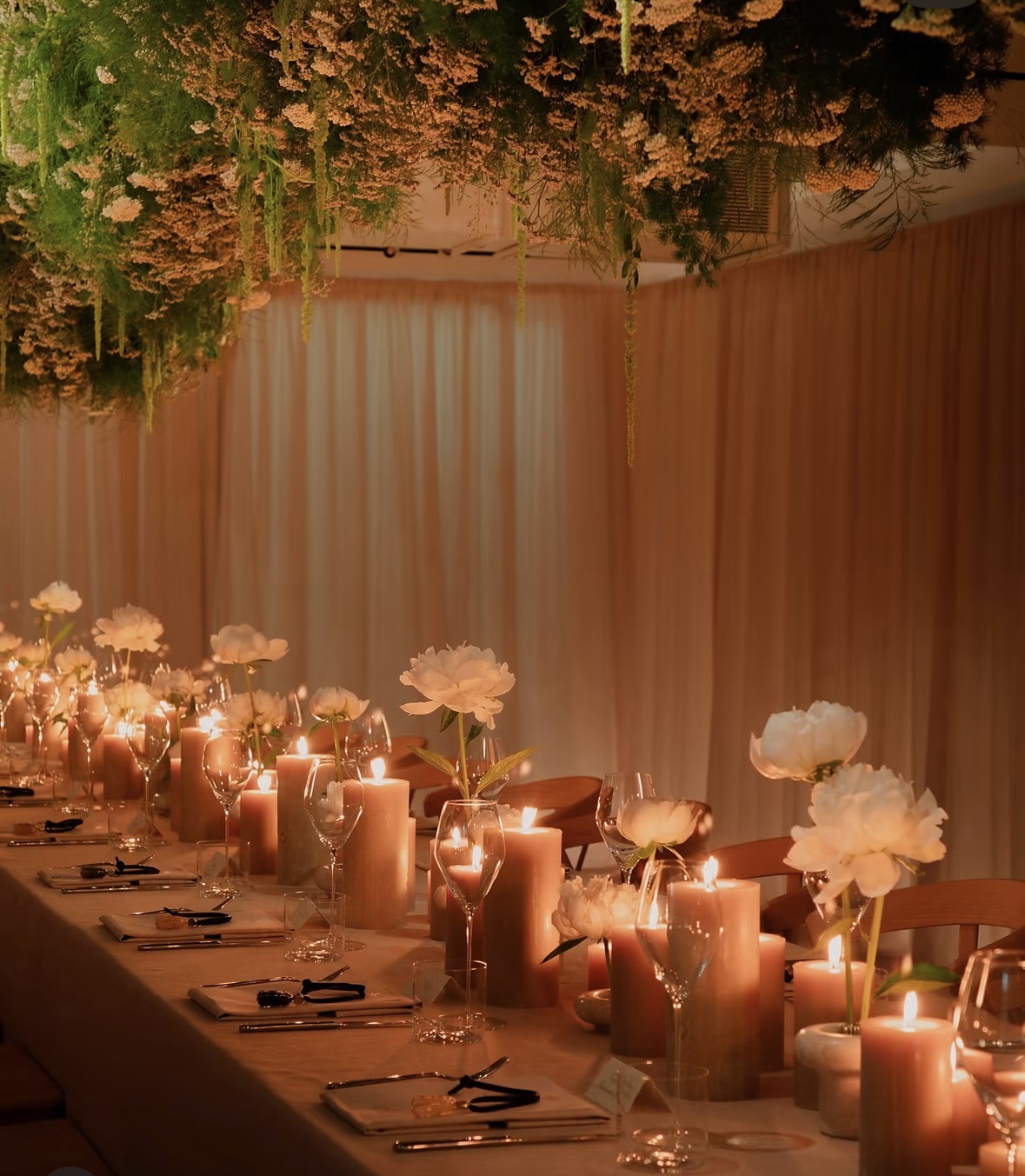 Candlelit floral dinner table